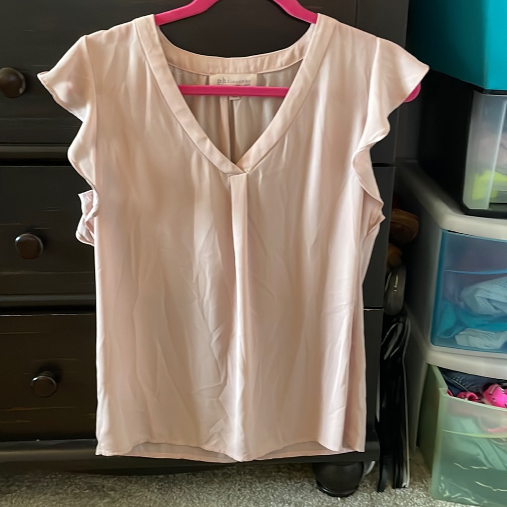 Pale pink women’s tank blouse.